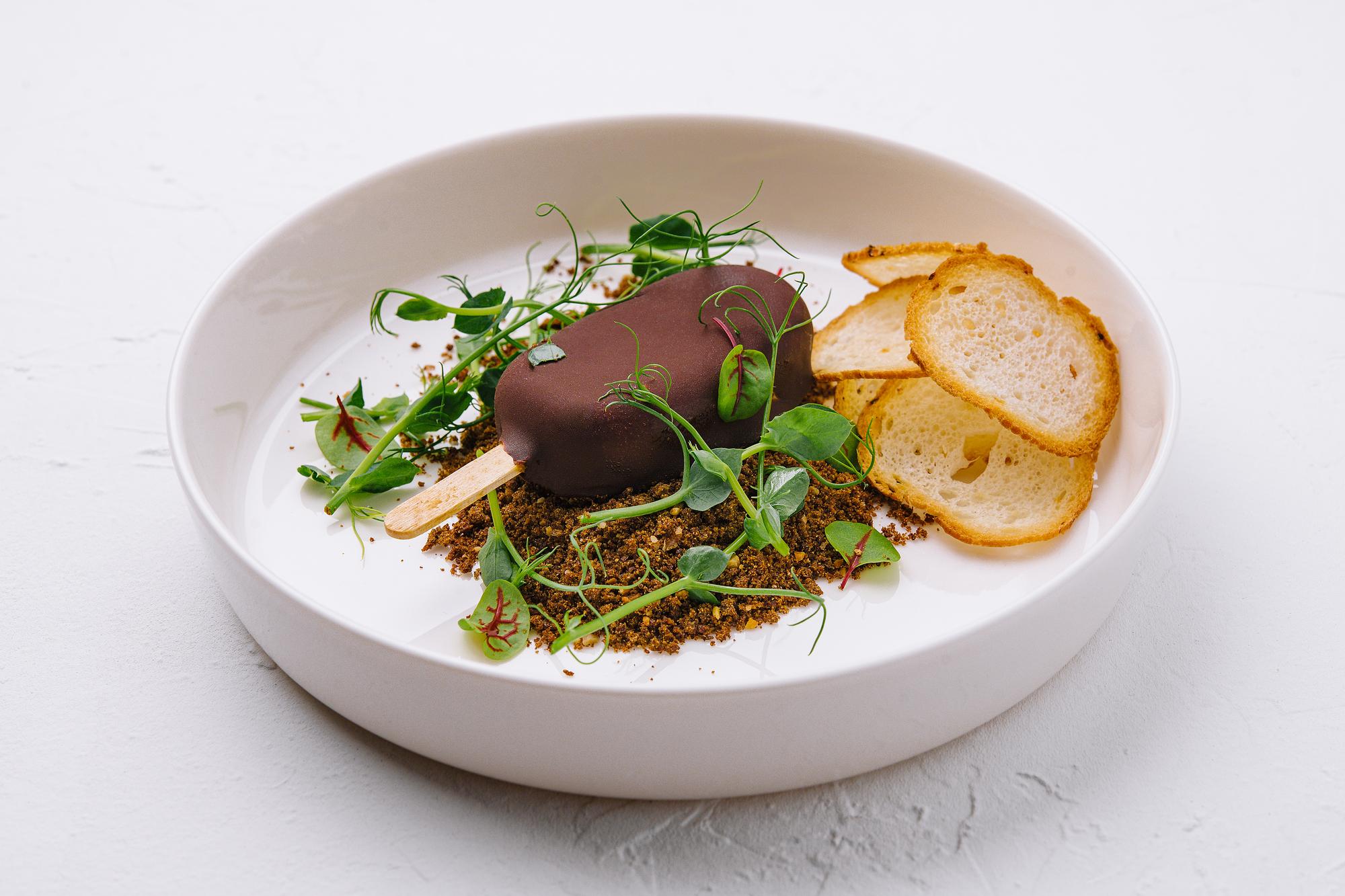 Close-up of plated dessert with microgreens
